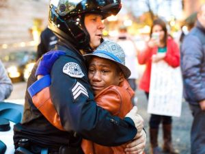 635528724545218809-AP-APTOPIX-Ferguson-Protest-Embrace